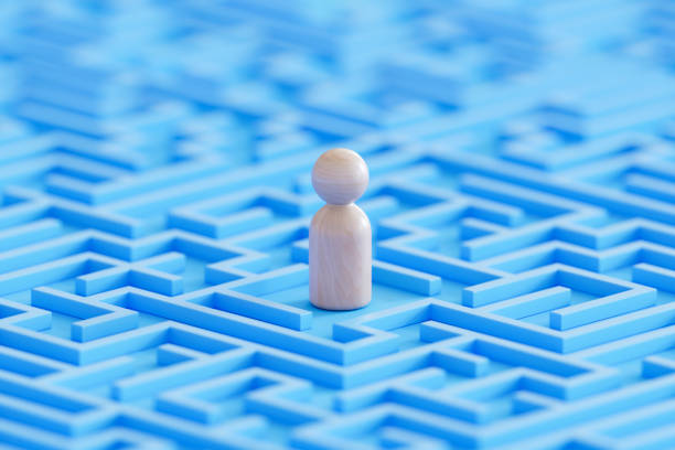 istock Pawn in blue maze 2174576144