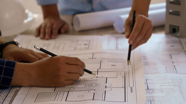 istock Engineer teams meeting working together. Foreman industry project manager engineer teamwork. Asian industry professional team. 2174576586
