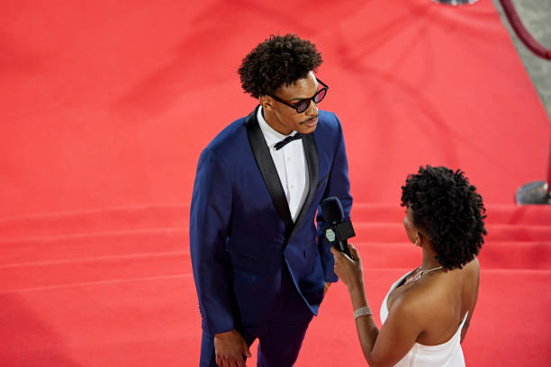 istock Red carpet interview with young Black celebrity 2174580609