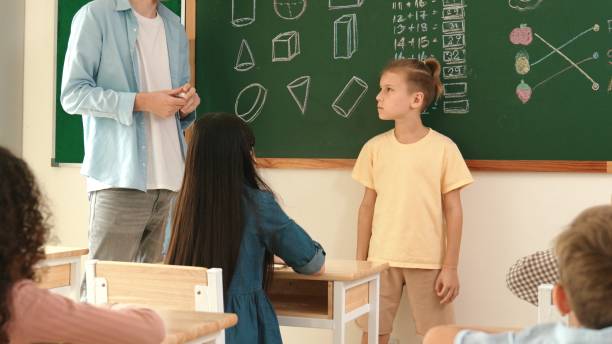 istock Skilled teacher talking and explain idea to asian child during class. Pedagogy. 2174581209