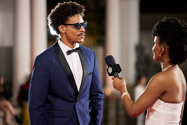 istock Black entertainment reporter and celebrity in conversation 2174581314