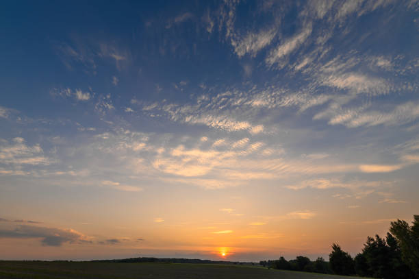 Rural landscape, freshly sown fields and sunset