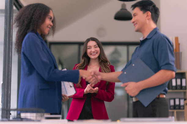 istock Business team shaking hands celebrating success Applause and shaking hands celebrating success in business deal Business people presenting their business start-up project together 2174581885
