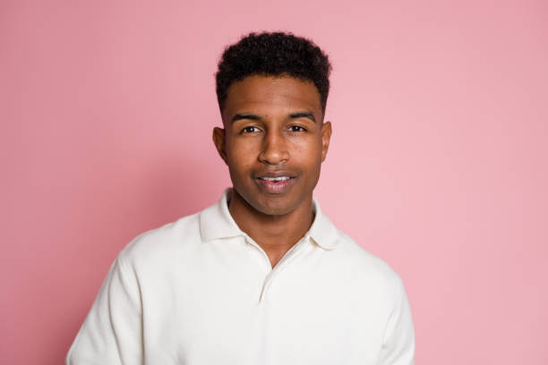 istock Young man smiling wearing white shirt on pink background 2174582806