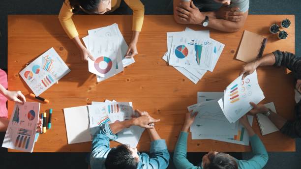 istock Top view of start up business team holding paper while discuss idea. Symposium. 2174583817