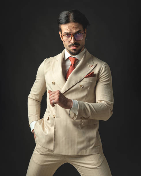 istock handsome young model standing with hand in pockets 2174588608