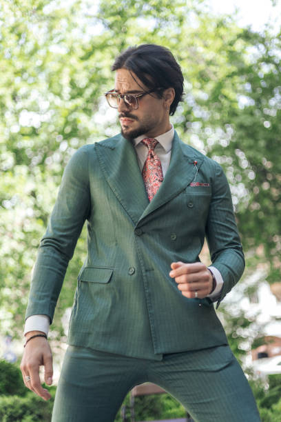 istock attractive elegant man with sunglasses looking to side and posing 2174589283