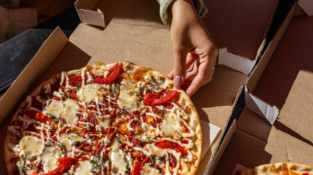 istock Pizza. Hawaiian Pizza. Pineapple Pizza. Pizza with pineapple, ham, onions, cheese, tomatoes, bacon, and sauce. 2174589877