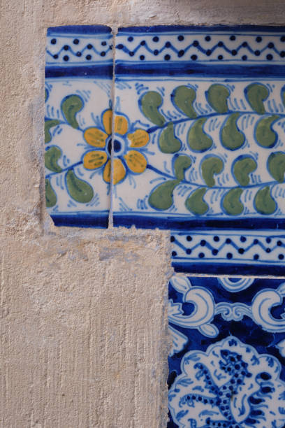 istock Painted tile on wall with yellow flower and ferns 2174594685