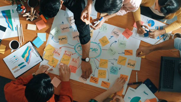 istock Business people writing at notes and making mind map at meeting. Convocation. 2174598290