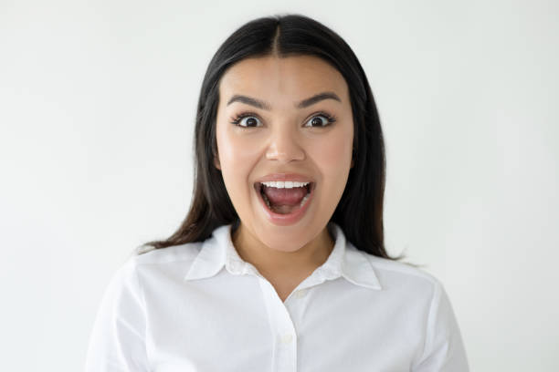 istock Surprised young woman looking at camera 2174600212