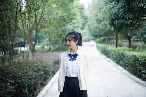 Asian young girl walking on campus