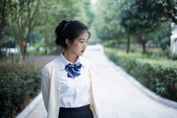 Asian young girl walking on campus
