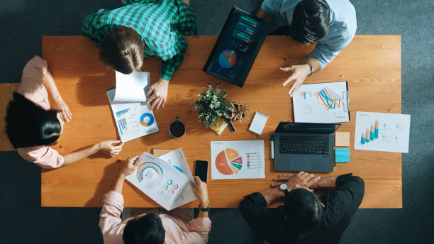 istock Top view of manager use tablet to analyze data and financial chart. Convocation. 2174605129