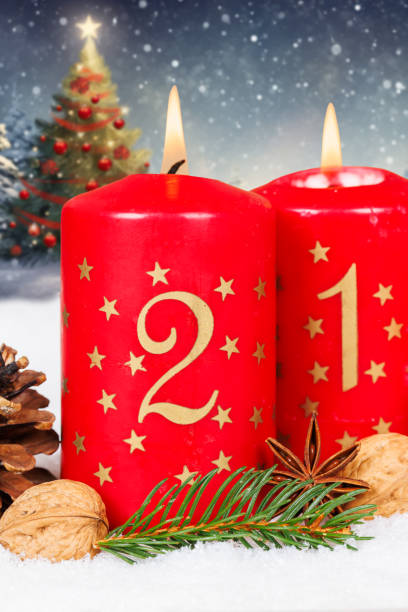 istock Second 2nd Sunday in advent with burning candle Christmas tree time portrait format and copyspace copy space 2174606435