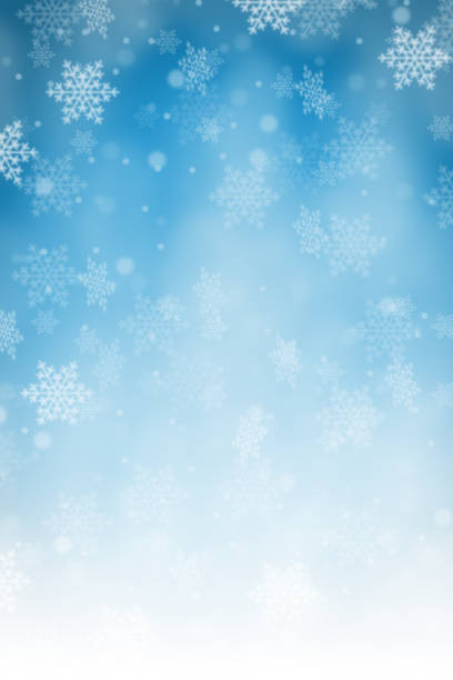 Christmas background with blue pattern winter card snow snowflakes portrait format copyspace copy space snowing