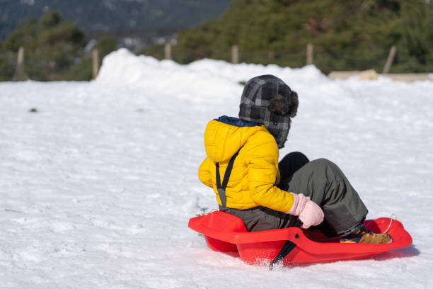 istock Unrecognizable boy riding a sleigh in the snow 2174607763