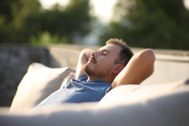 Man resting and relaxing alone sitting in a terrace