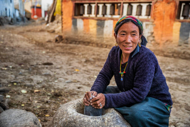 an old woman is making thread handicraft items in Gatlang, Rasuwa, Nepal, on  Wednesday March 05, 2025.