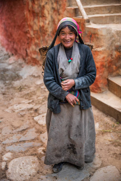 istock Tibetan woman carrying basket, Upper Mustang, Nepal 2174607962