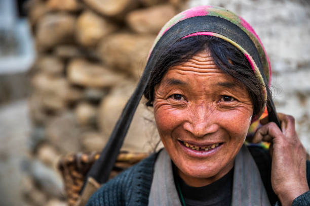 istock Tibetan woman carrying basket, Upper Mustang, Nepal 2174608152