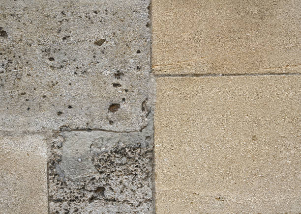 Fragment of old stone wall outdoors. Wall texture, background