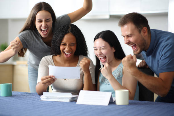 istock Excited interracial roommates checking recipe at home 2174608458