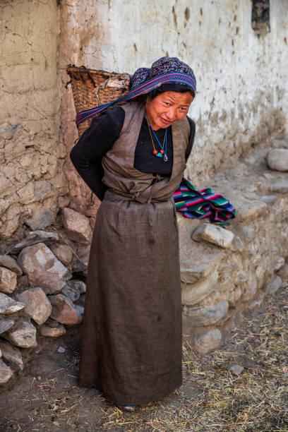 istock Tibetan woman carrying basket, Upper Mustang, Nepal 2174608464