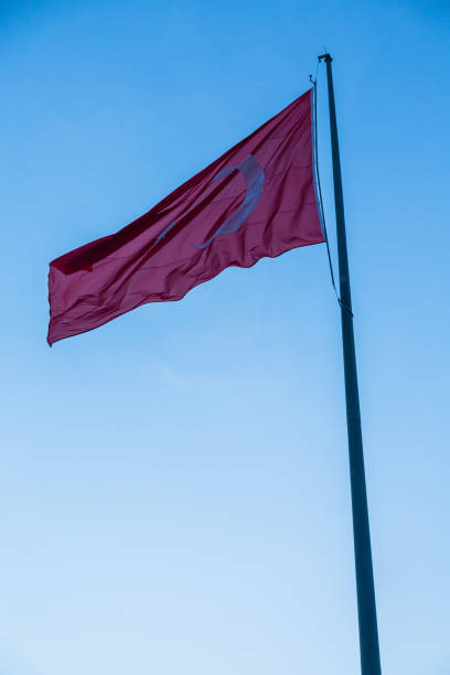 istock Turkish flag flying in the sky at dusk 2174609210