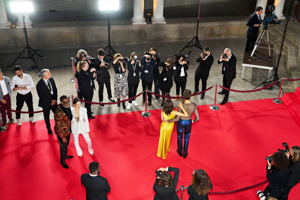 istock Celebrities, security, and press pen at red carpet event 2174614123