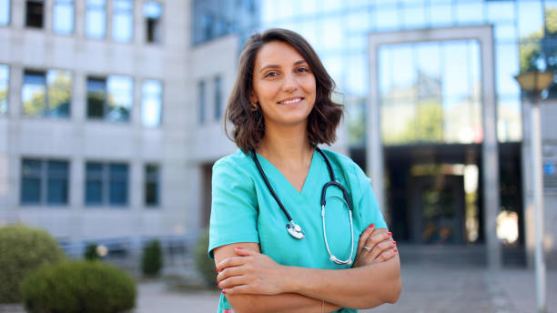 istock Beautiful, young doctor on a break outside 2174620394
