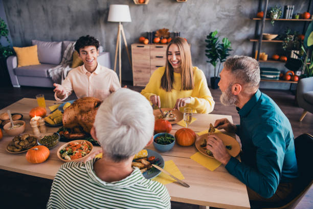 Portrait of big friendly family chatting speak eat celebrate thanksgiving day dinner flat indoors Portrait of big friendly family chatting speak eat celebrate thanksgiving day dinner flat indoors. thanksgiving full stock pictures, royalty-free photos & images