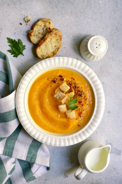 istock Delicious pumpkin soup with croutons. Top view with copy space. 2174624134