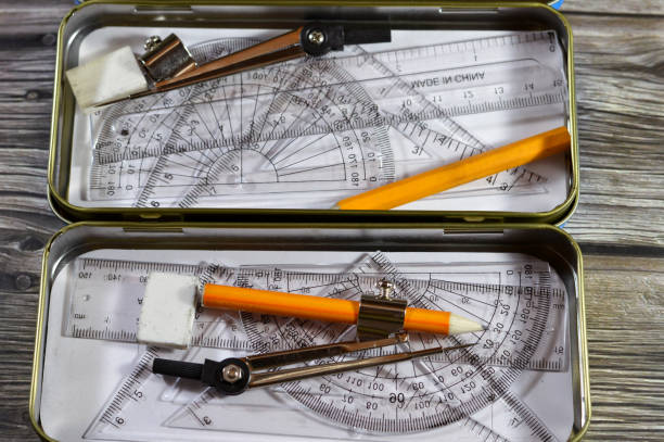Mathematical instrument box, geometry set in metal case for students in school, protractor, triangle, pencil, ruler, eraser, compass, back to school and educational tools concept, drawing set