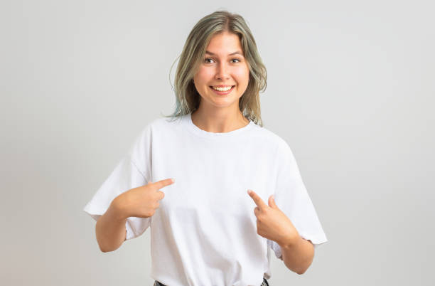 istock Young woman points at herself with both index fingers 2174625068