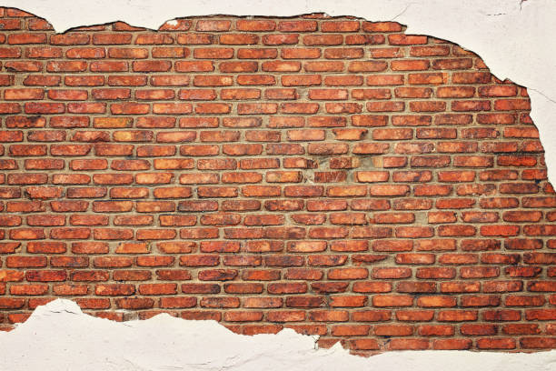 istock rustic brick wall with peeling concrete, texture of old stonework as background 2174625568