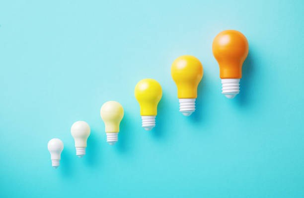 istock Lightbulbs On Blue Background - Success And Creativity Concept 2174626576