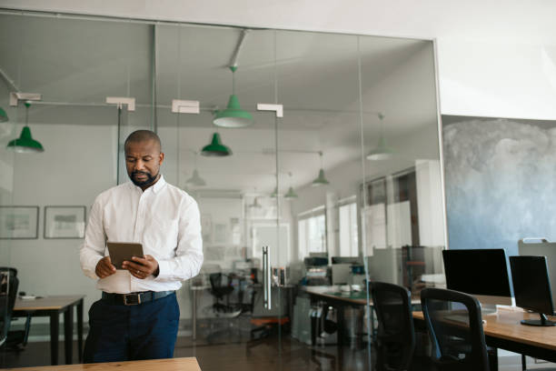 istock African American businessman working on a tablet in his office 2174629220
