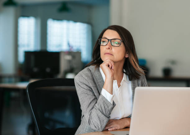 istock Businesswoman thinking about work while sitting at her office desk 2174629293