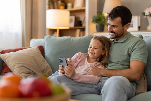 istock Happy Dad, Child With Phone for Streaming 2174631003