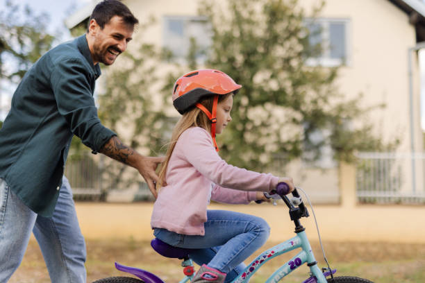 istock Finding her balance and coordination on her bike 2174631230
