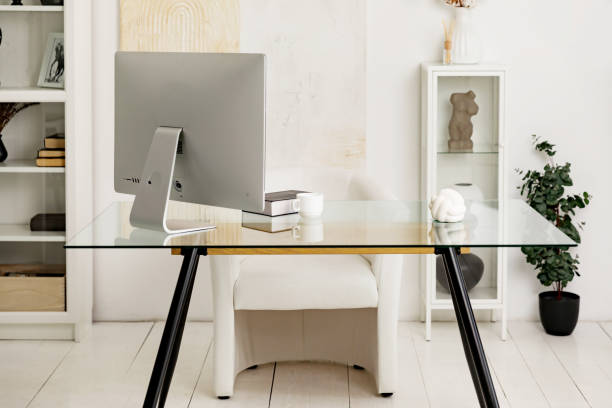 istock cozy home office in a modern studio apartment with a desk, computer, books, decor, flowers in flower pots 2174632443