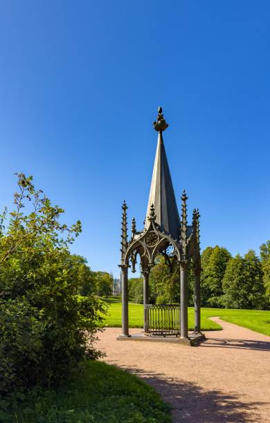 istock Gothic Pavilion in a Green Park on a Bright Sunny Day 2174632488