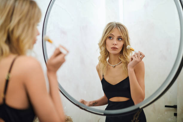 istock A beautiful young woman enjoying her wellness routine at home in a stylish mirror reflection 2174636736