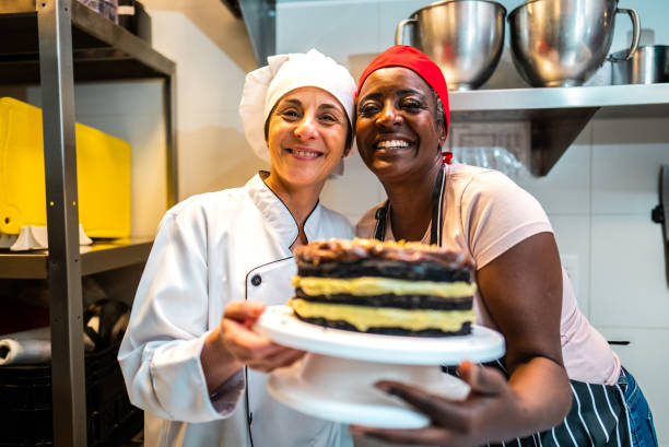 istock Portrait of a chef and mature student during cooking class at bakery kitchen 2174643205