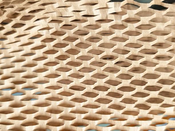 istock Hexcel wrap. Sustainable craft paper packaging. Brown honeycomb grid texture background. Abstract brown backdrop 2174643658