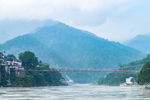 istock Tourists walking on lakshman jhula bridge in rishikesh india 2174644647