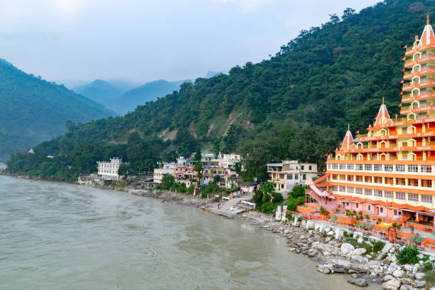 istock Ganga river flowing past colorful buildings in rishikesh india 2174644809
