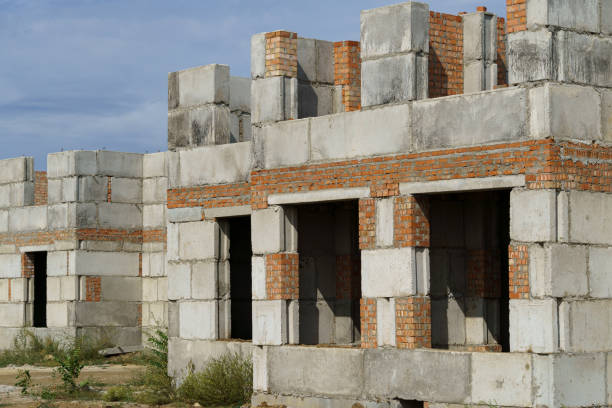 istock a construction site with a house under construction against the sky 2174645396