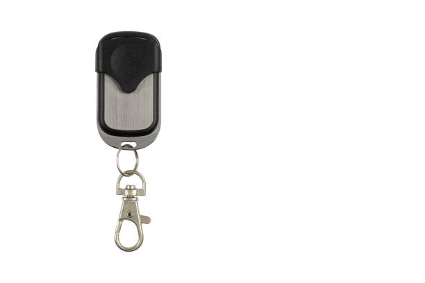A high-quality image of a black car key fob isolated on a white background. Ideal for showcasing automotive keyless entry systems, security devices, and car remote controls.